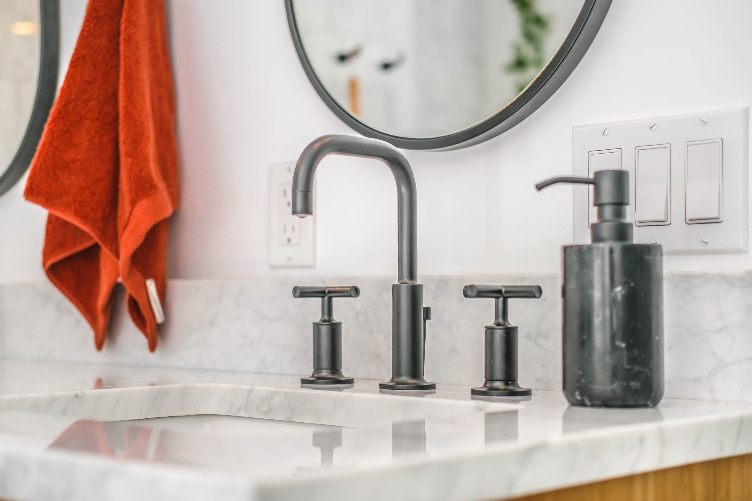 Bathroom countertop with black faucet fixtures